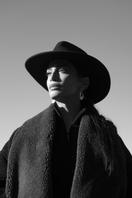 black and white portrait of a woman with a hat